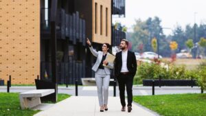 two business people walking by a building